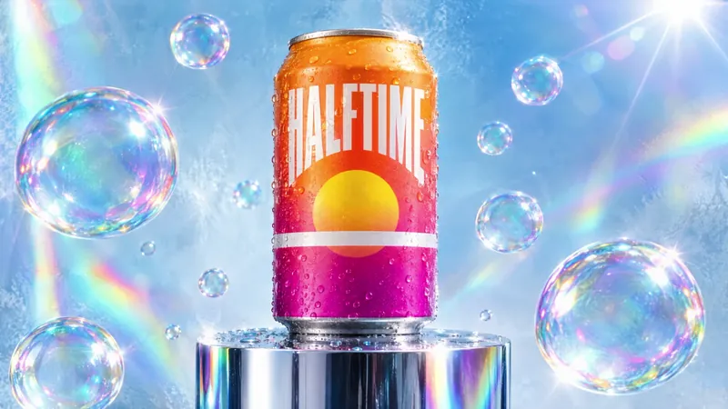 Halftime sparkling citrus can on a chrome pedestal surrounded by iridescent bubbles